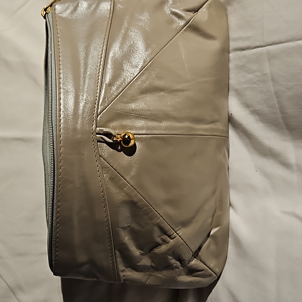Head Liner champagne leather clutch purse